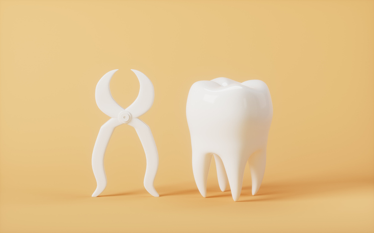 3-D rendering of a tooth standing beside pair of dental forceps