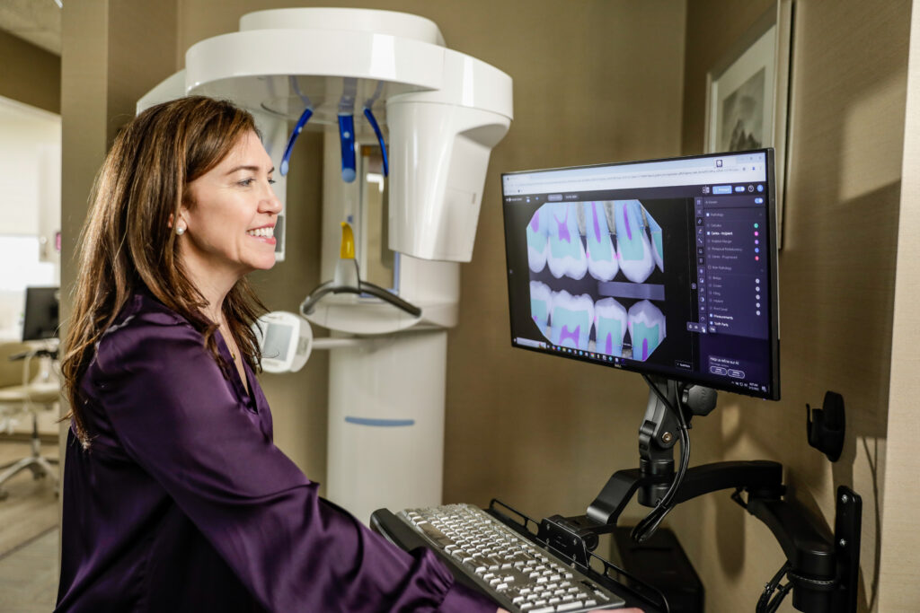 Dr. Thurmon at an Xray machine smiling