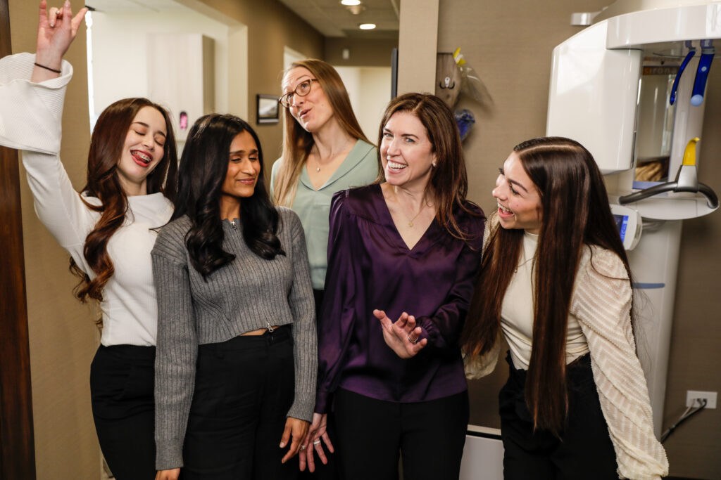 The staff hanging out in the hallway having a good ol' time.