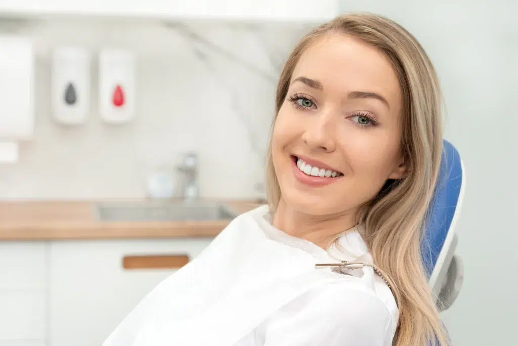 Young woman smiling in a dentist chair